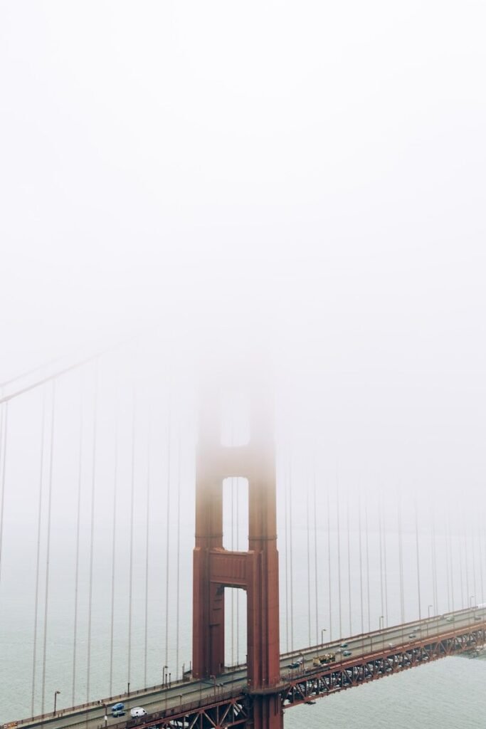 a foggy view of the golden gate bridge