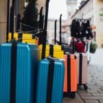 a group of suitcases are lined up on the sidewalk