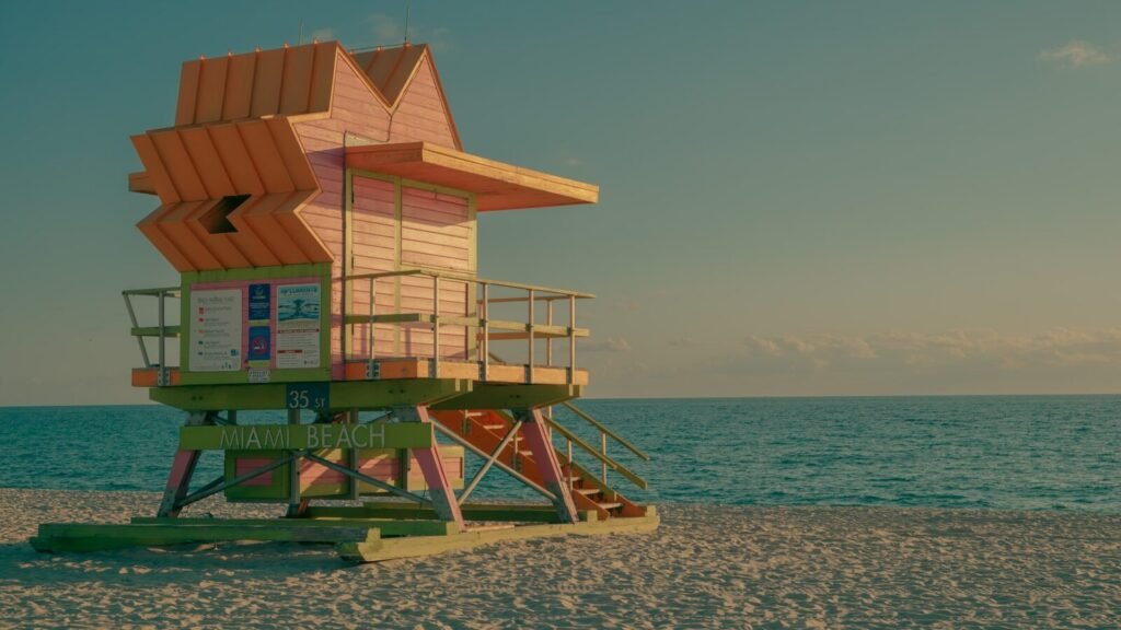 Orange lifeguard tower on a sandy beach