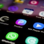 a close up of a cell phone with different app icons