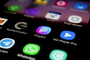 a close up of a cell phone with different app icons